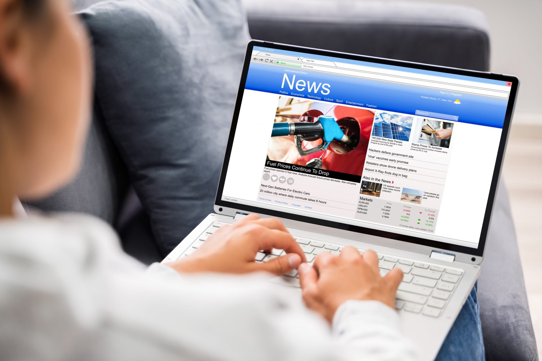 Watching News On Laptop Computer Screen Online At Home