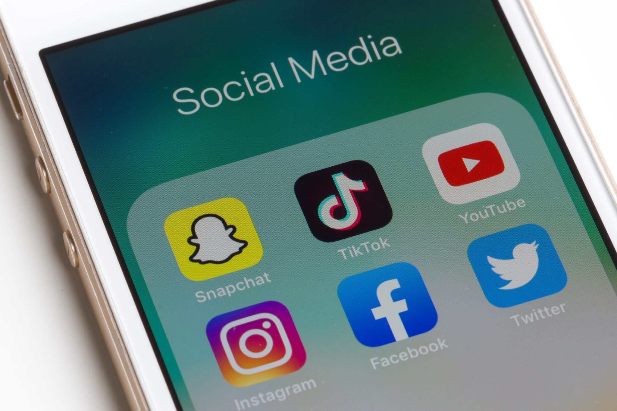 Portland, OR, USA - Nov 5, 2019: Snapchat, TikTok, Youtube, Instagram, Facebook, and Twitter mobile app icons are seen on an iPhone.