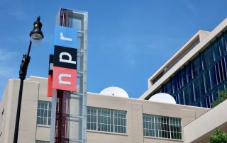 WASHINGTON, DC - JUNE 8, 2019: NPR - NATIONAL PUBLIC RADIO - sign at headquarters building entrance